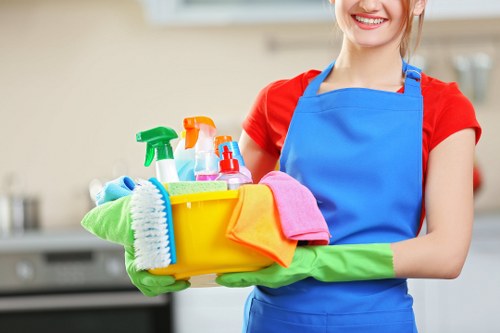Cleaner preparing safe deep cleaning equipment and PPE